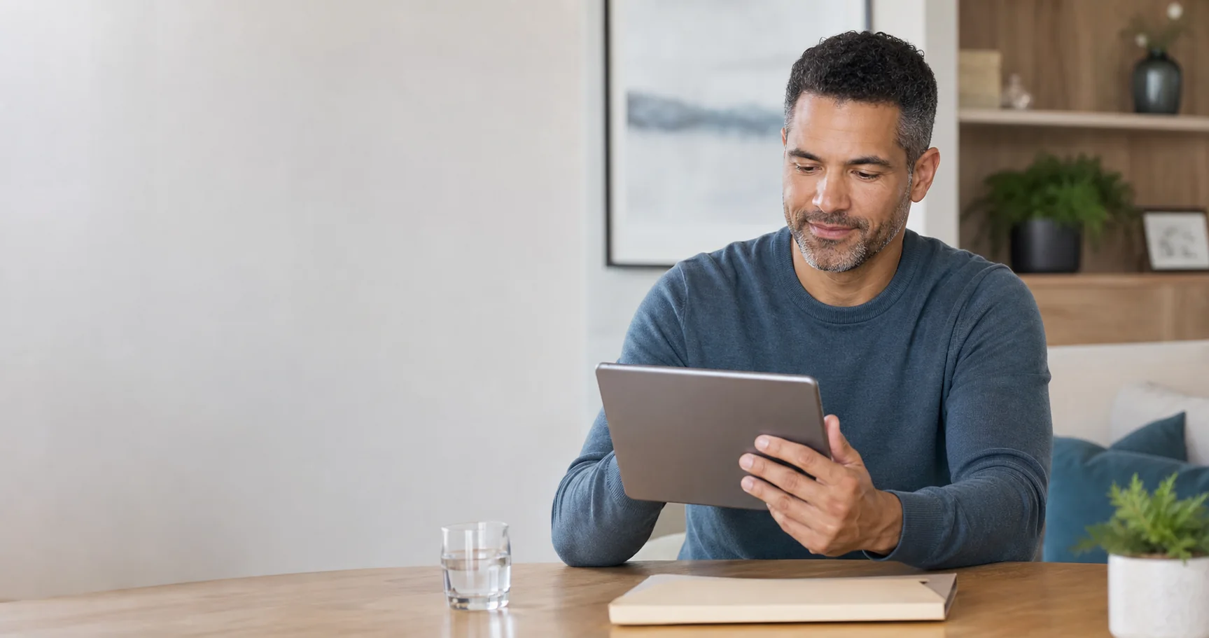 A man reviewing personal health information on a tablet